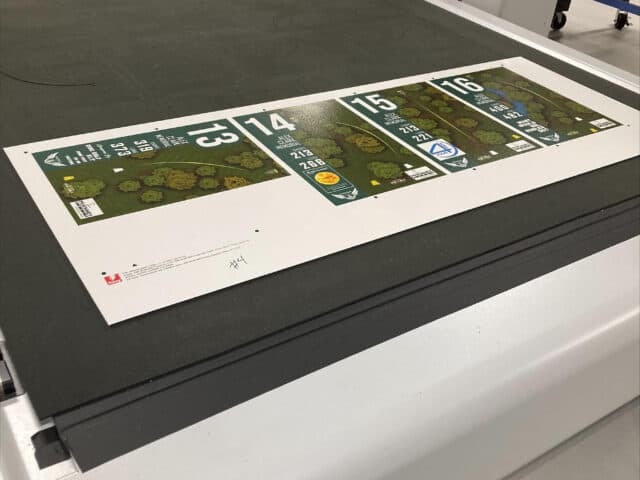 Disc golf tee signs printed on aluminum composite material, ready for cutting
