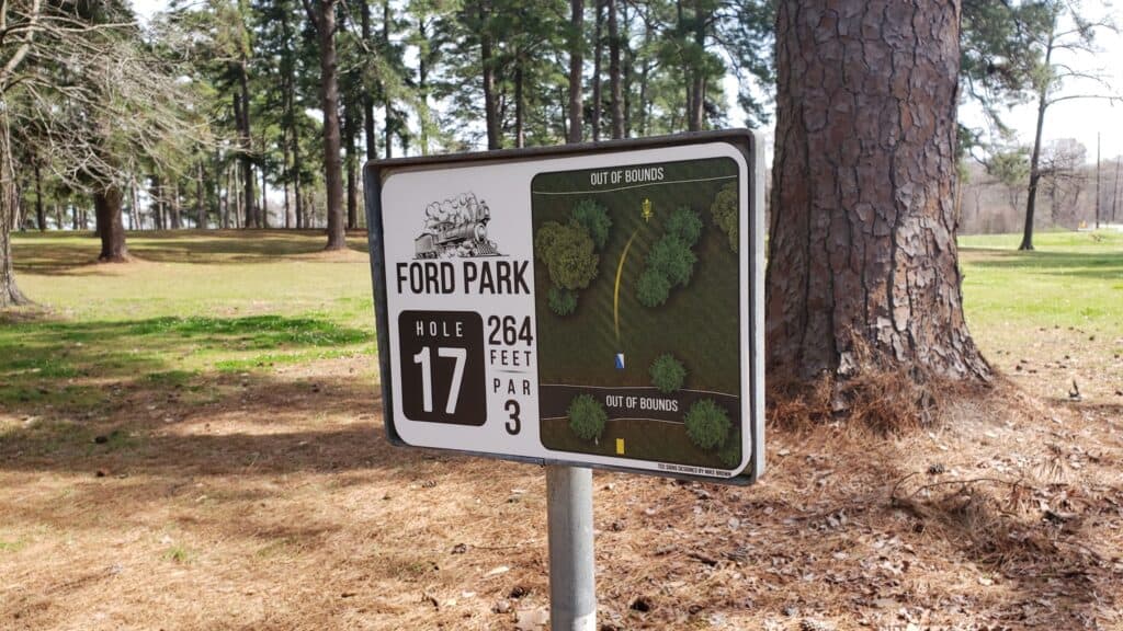Disc golf hole sign at Ford Park with course layout and hole details.