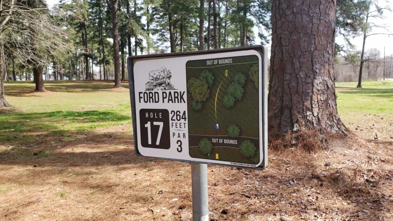 Disc golf hole sign at Ford Park with course layout and hole details.