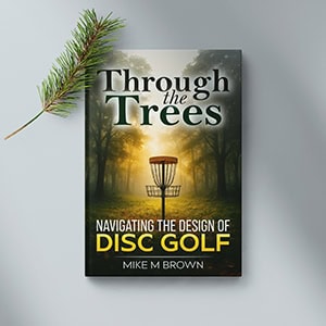 Book cover of "Through the Trees" about disc golf design and navigation.