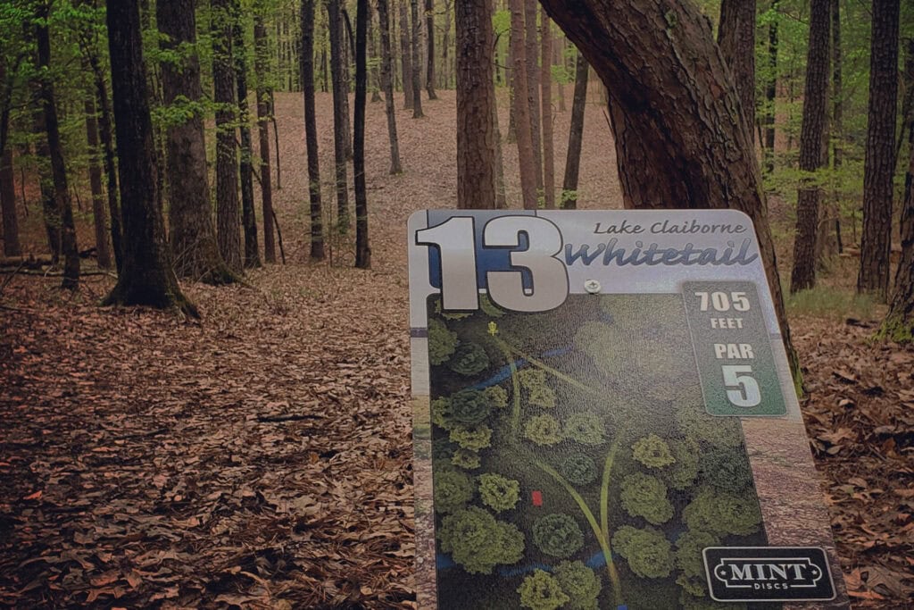 Outdoor disc golf course directional sign for easy navigation and reduced maintenance requests.